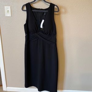 White House Black Market. Black dress size 14. SL Shth w Mesh Cutouts. Lined.